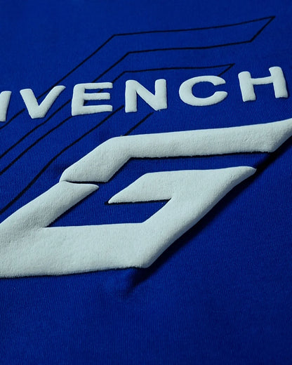 Close-up of Givenchy logo on a blue background