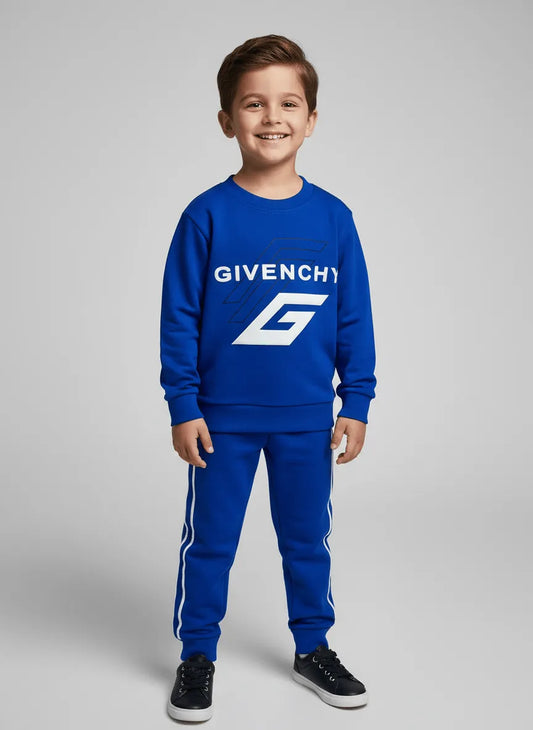Child wearing a blue Givenchy tracksuit on a gray background