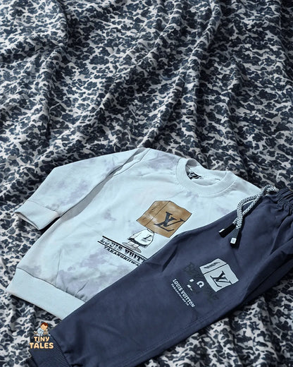 Louis Vuitton sweatshirt and pants on a patterned fabric background
