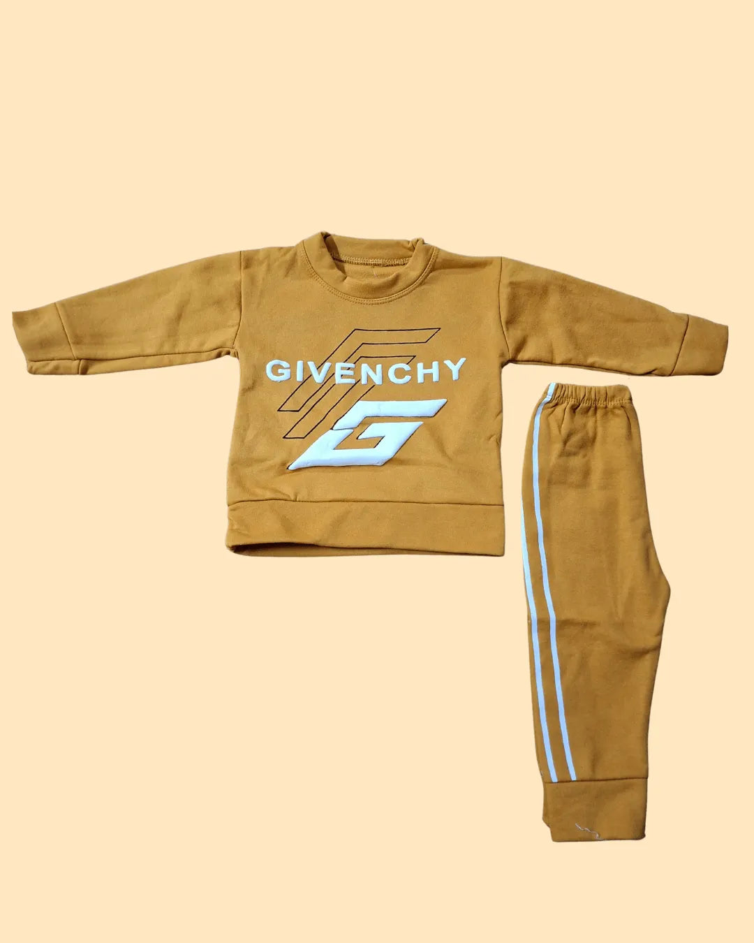 Brown children's sweatshirt and pants set with Givenchy logo on a beige background